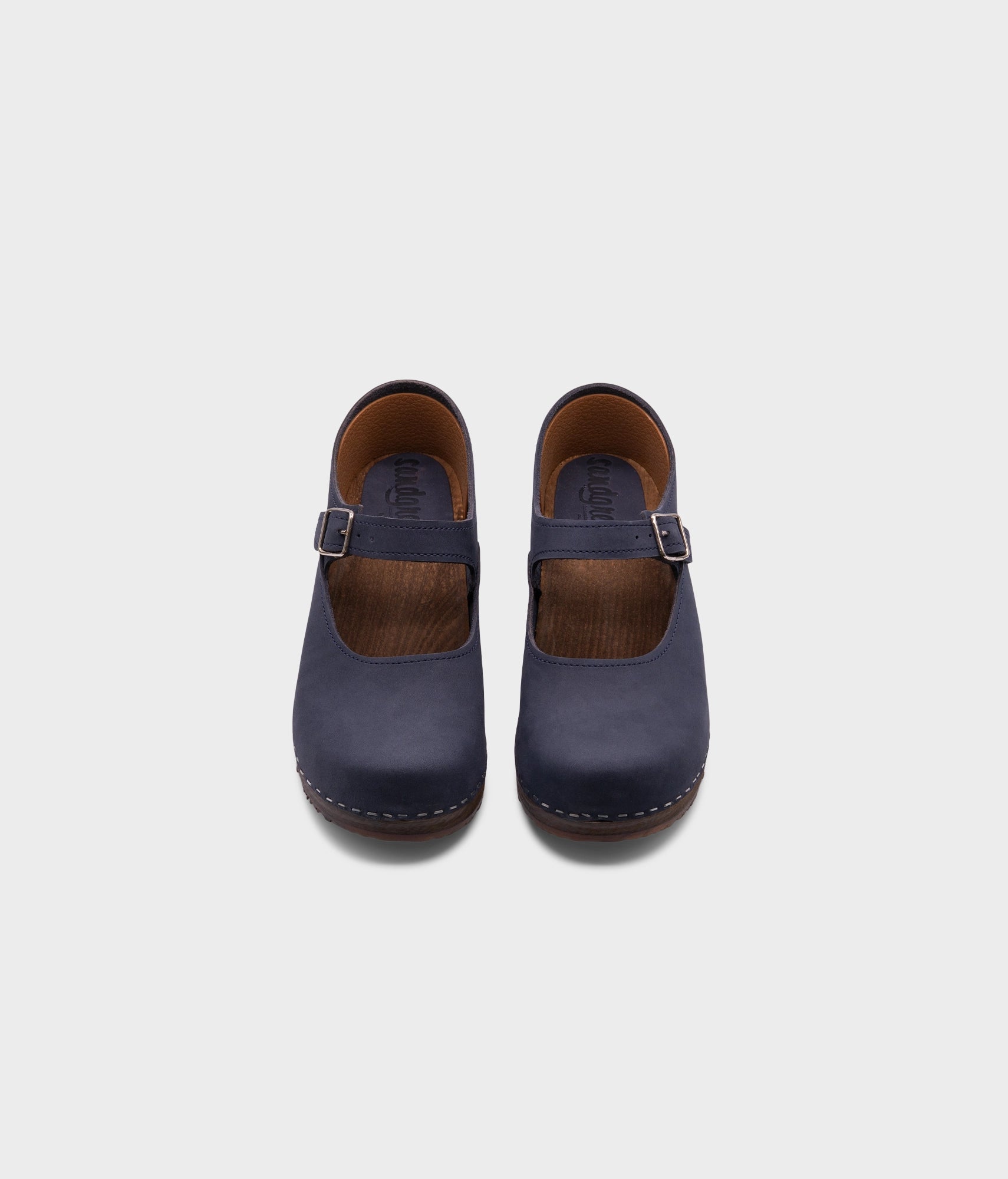Mary Jane wooden clogs in navy blue nubuck leather stapled on a dark wooden base