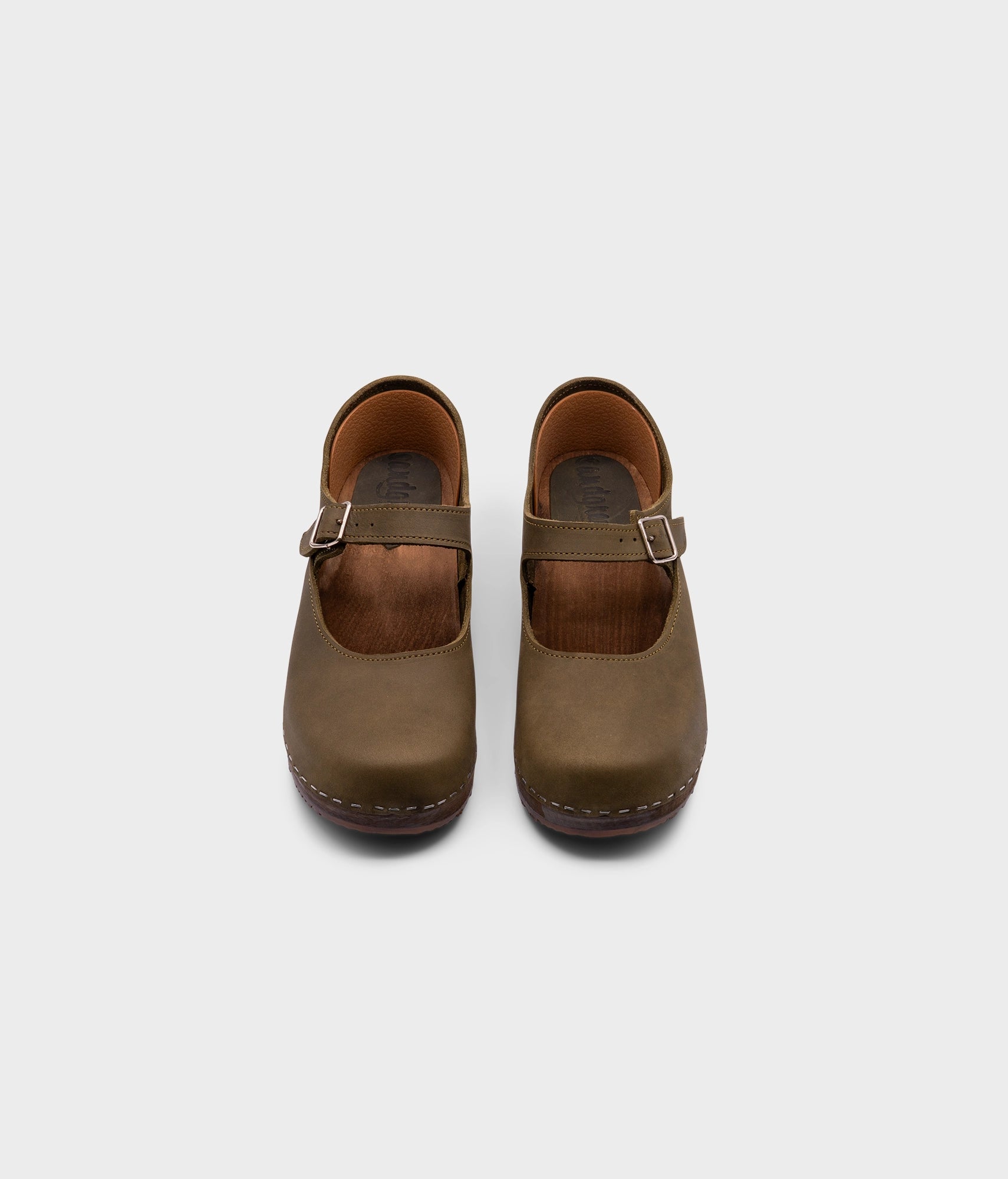 Mary Jane wooden clogs in olive green nubuck leather stapled on a dark wooden base