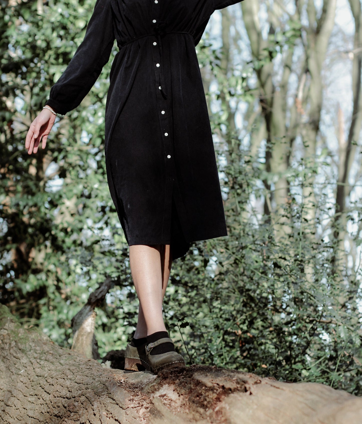 Mary Jane wooden clogs in olive green nubuck leather stapled on a dark wooden base