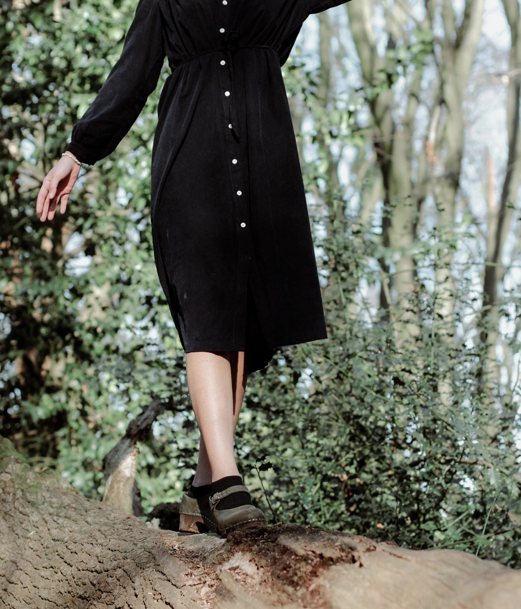 Mary Jane wooden clogs in olive green nubuck leather stapled on a dark wooden base