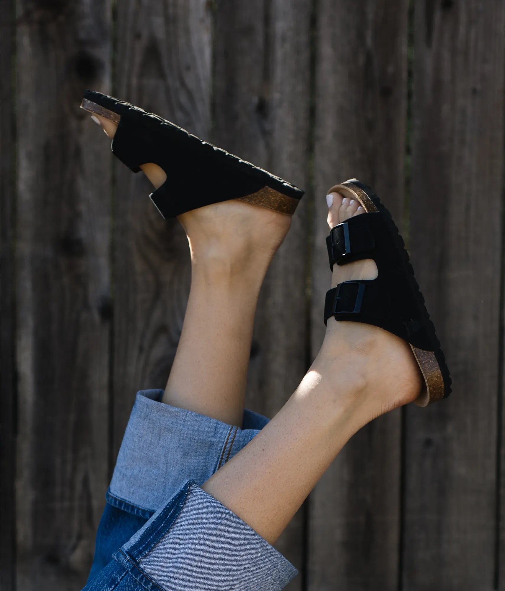 classic cork sandal with two straps in a comfortable black suede leather with a suede footbed 