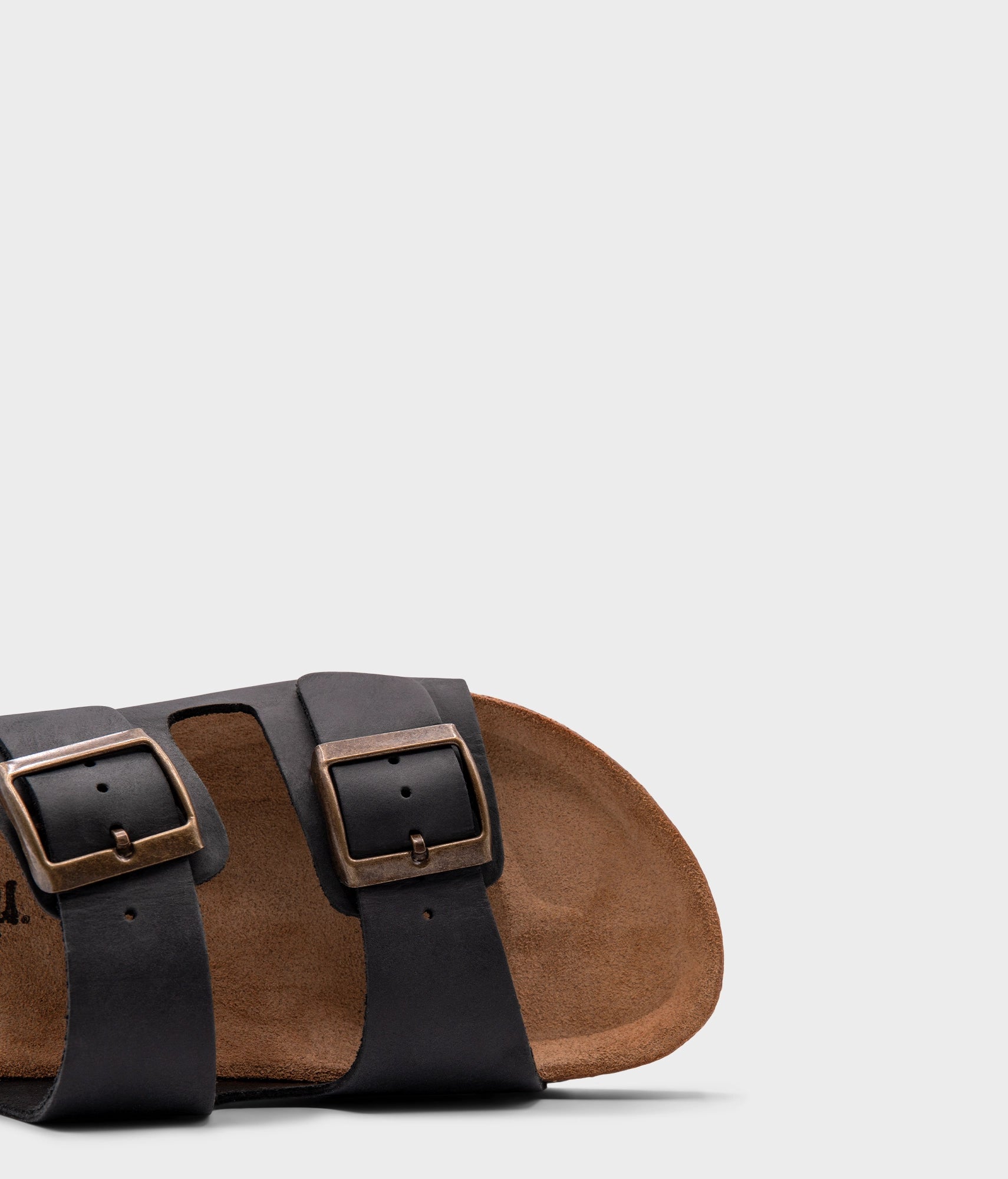 classic cork sandal with two straps in full-grain black nubuck leather with a blue tint, suede footbed and brass gold buckles