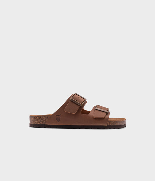classic cork sandal with two straps in full-grain light brown nubuck leather, suede footbed and brass gold buckles
