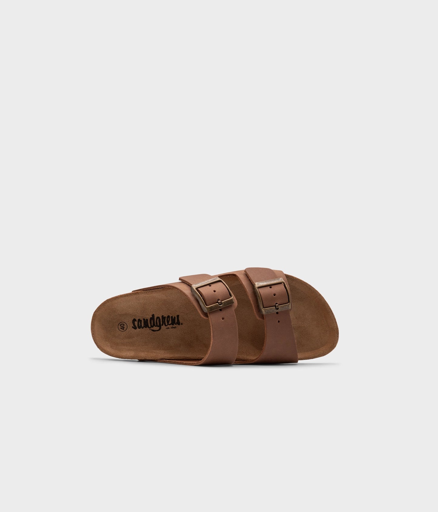 classic cork sandal with two straps in full-grain light brown nubuck leather, suede footbed and brass gold buckles