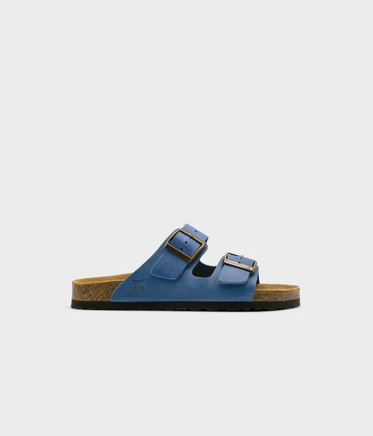classic cork sandal with two straps in full-grain blue nubuck leather with a blue tint, suede footbed and brass gold buckles