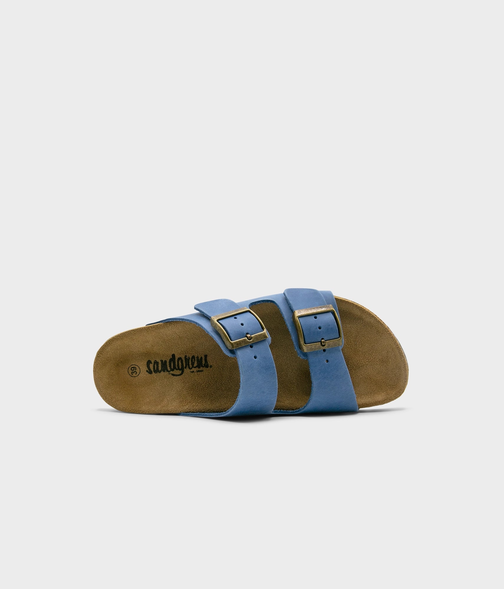 classic cork sandal with two straps in full-grain blue nubuck leather with a blue tint, suede footbed and brass gold buckles