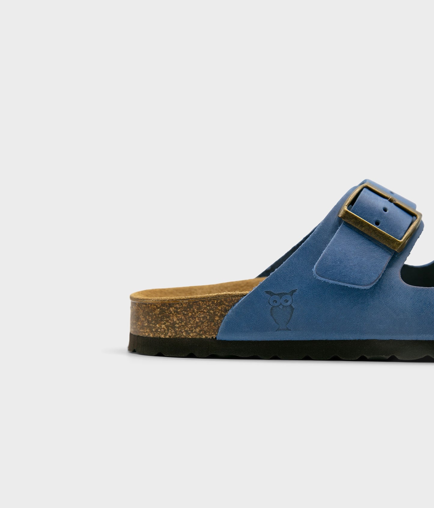 classic cork sandal with two straps in full-grain blue nubuck leather with a blue tint, suede footbed and brass gold buckles