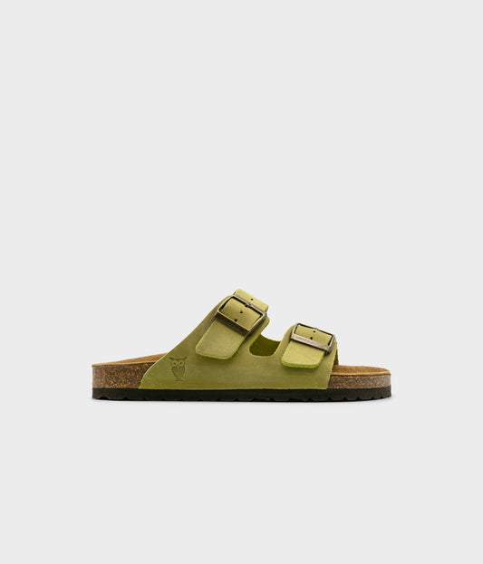 classic cork sandal with two straps in full-grain sage green nubuck leather with a blue tint, suede footbed and brass gold buckles