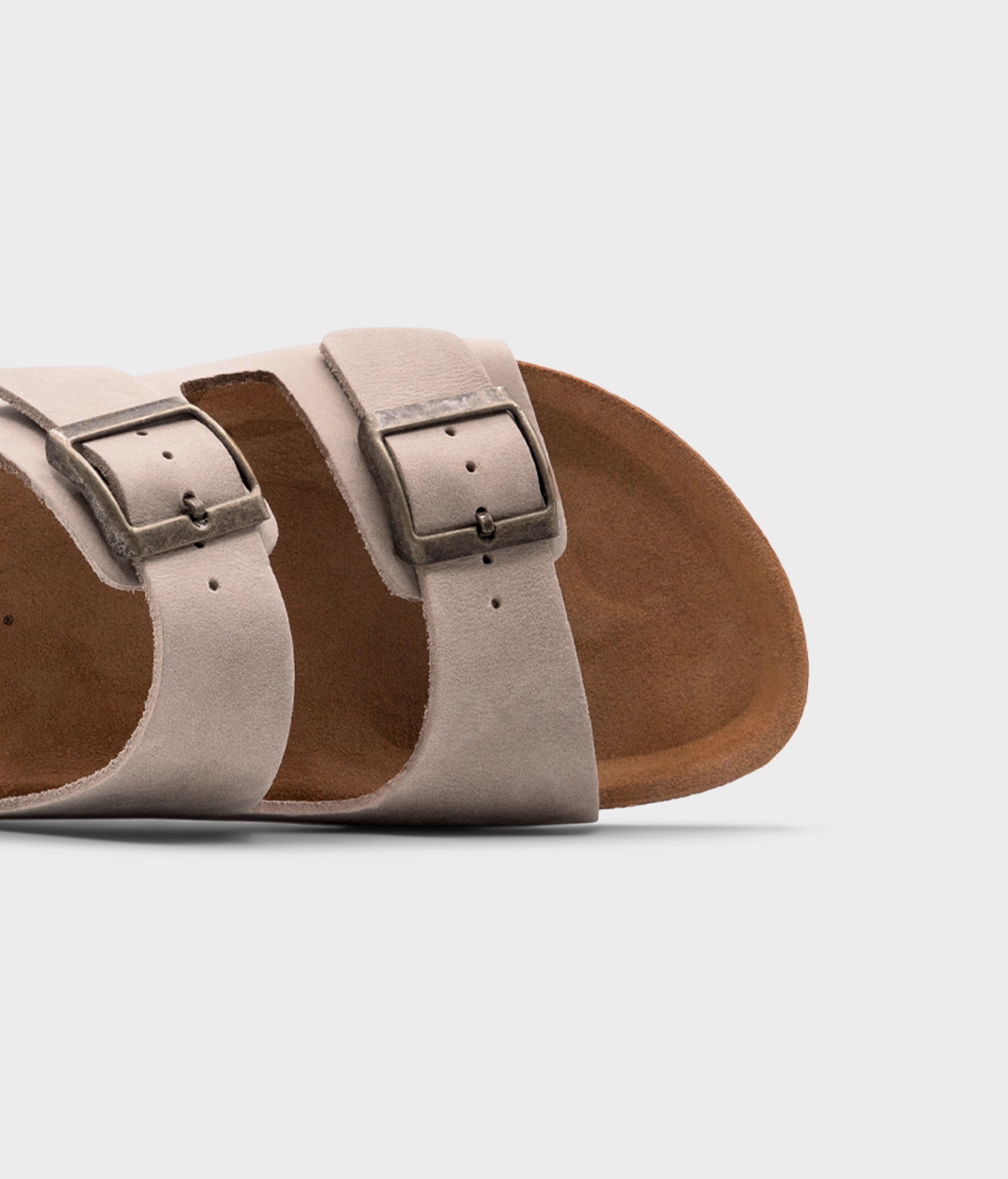 classic cork sandal with two straps in full-grain sand beige nubuck leather, suede footbed and brass gold buckles