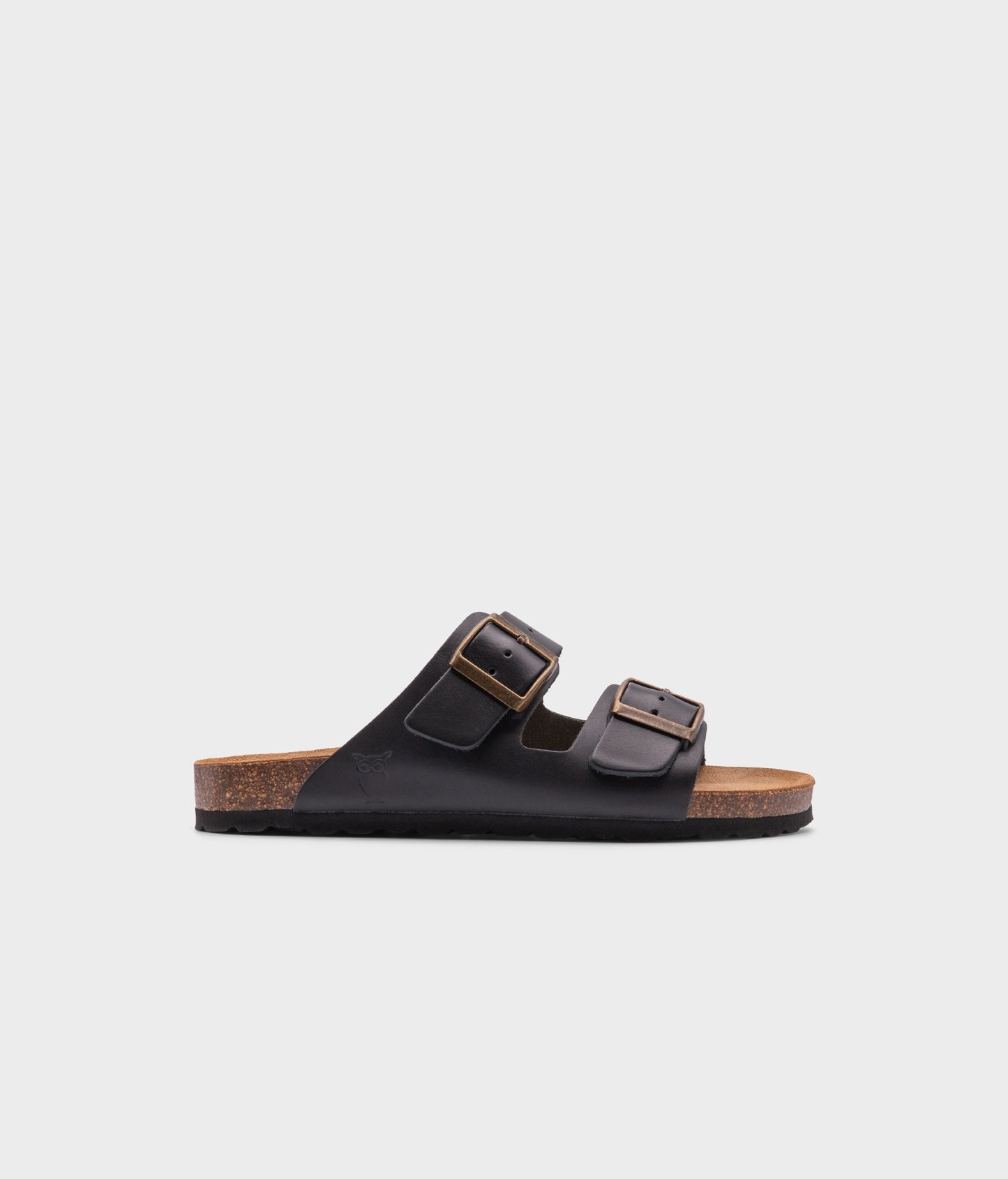 classic cork sandal with two straps in top-grain black vegetable tanden leather, suede footbed and brass gold buckles