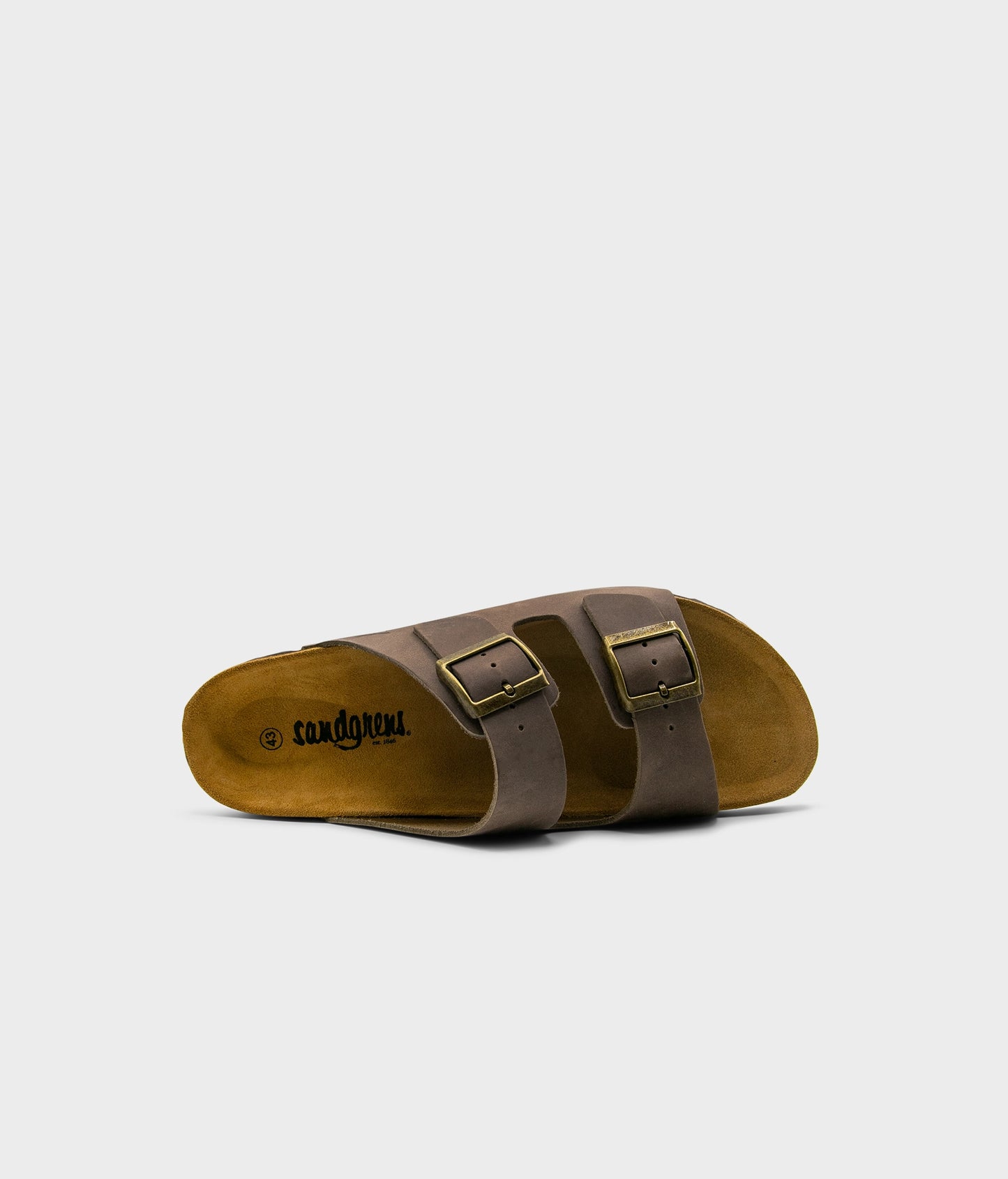 classic cork sandal with two straps in full-grain walnut brown nubuck leather with a blue tint, suede footbed and brass gold buckles