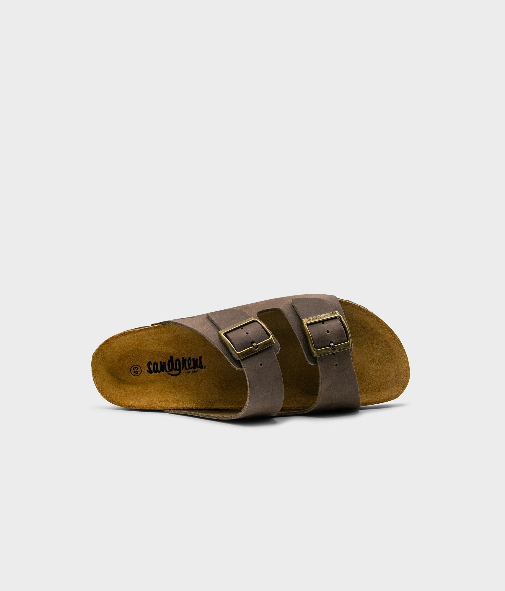 classic cork sandal with two straps in full-grain walnut brown nubuck leather with a blue tint, suede footbed and brass gold buckles