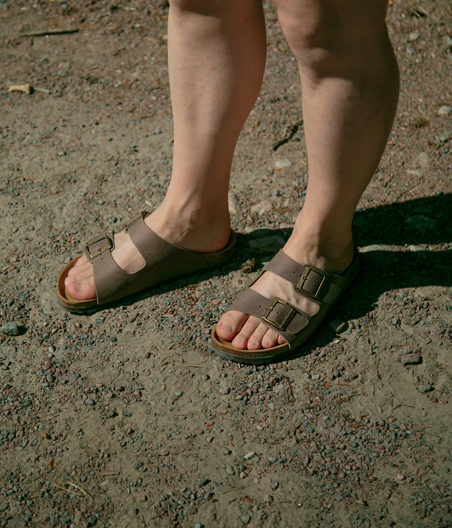 classic cork sandal with two straps in full-grain walnut brown nubuck leather with a blue tint, suede footbed and brass gold buckles