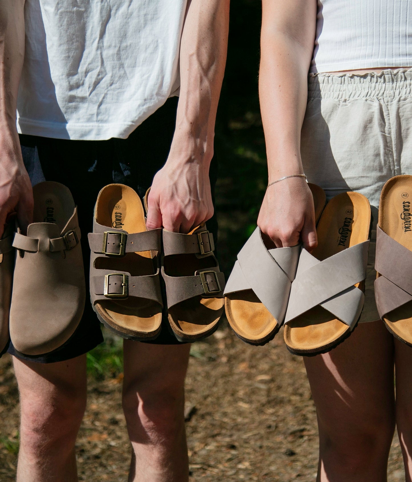 classic cork sandal with two straps in full-grain walnut brown nubuck leather with a blue tint, suede footbed and brass gold buckles