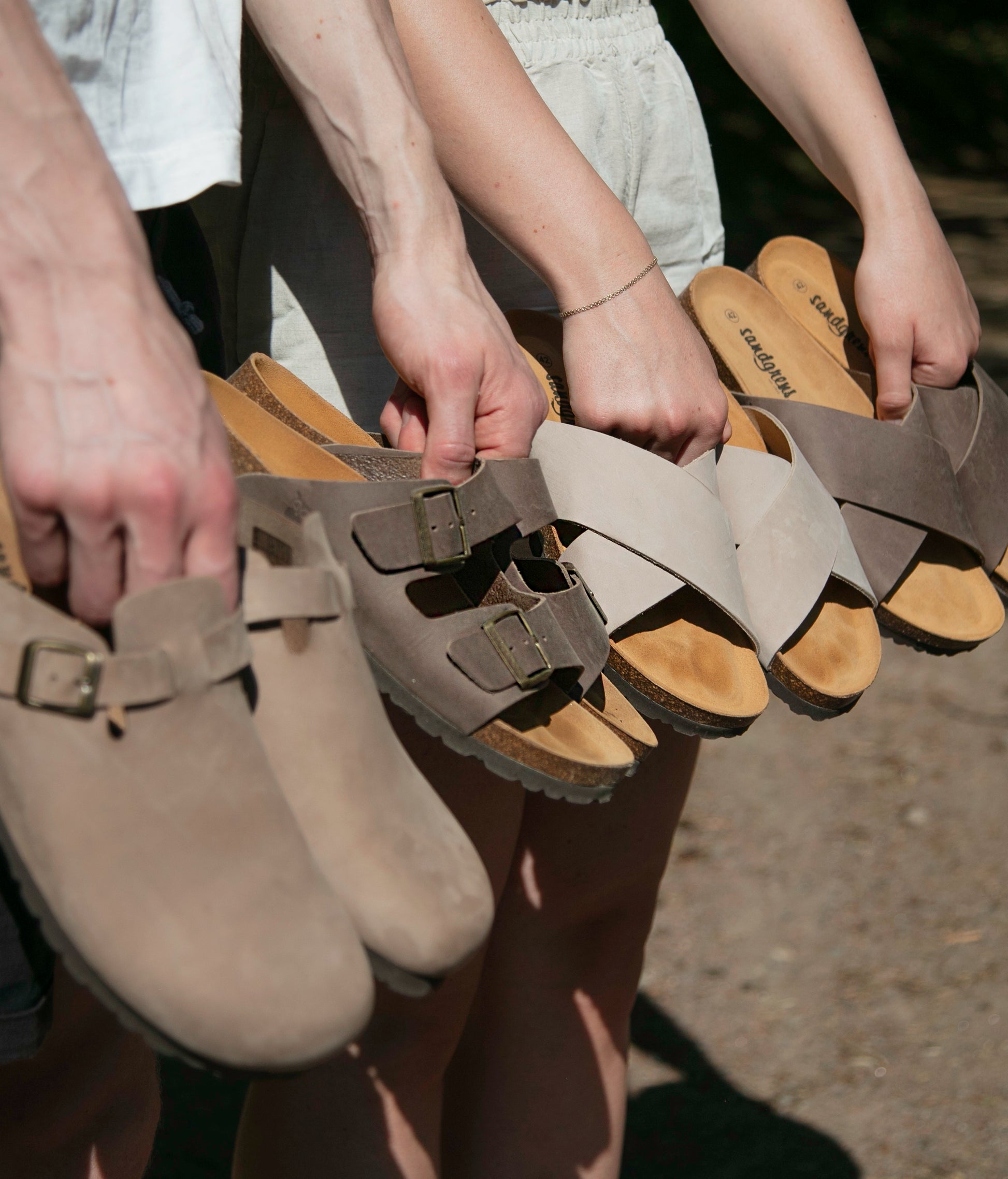 classic cork sandal with two straps in full-grain walnut brown nubuck leather with a blue tint, suede footbed and brass gold buckles