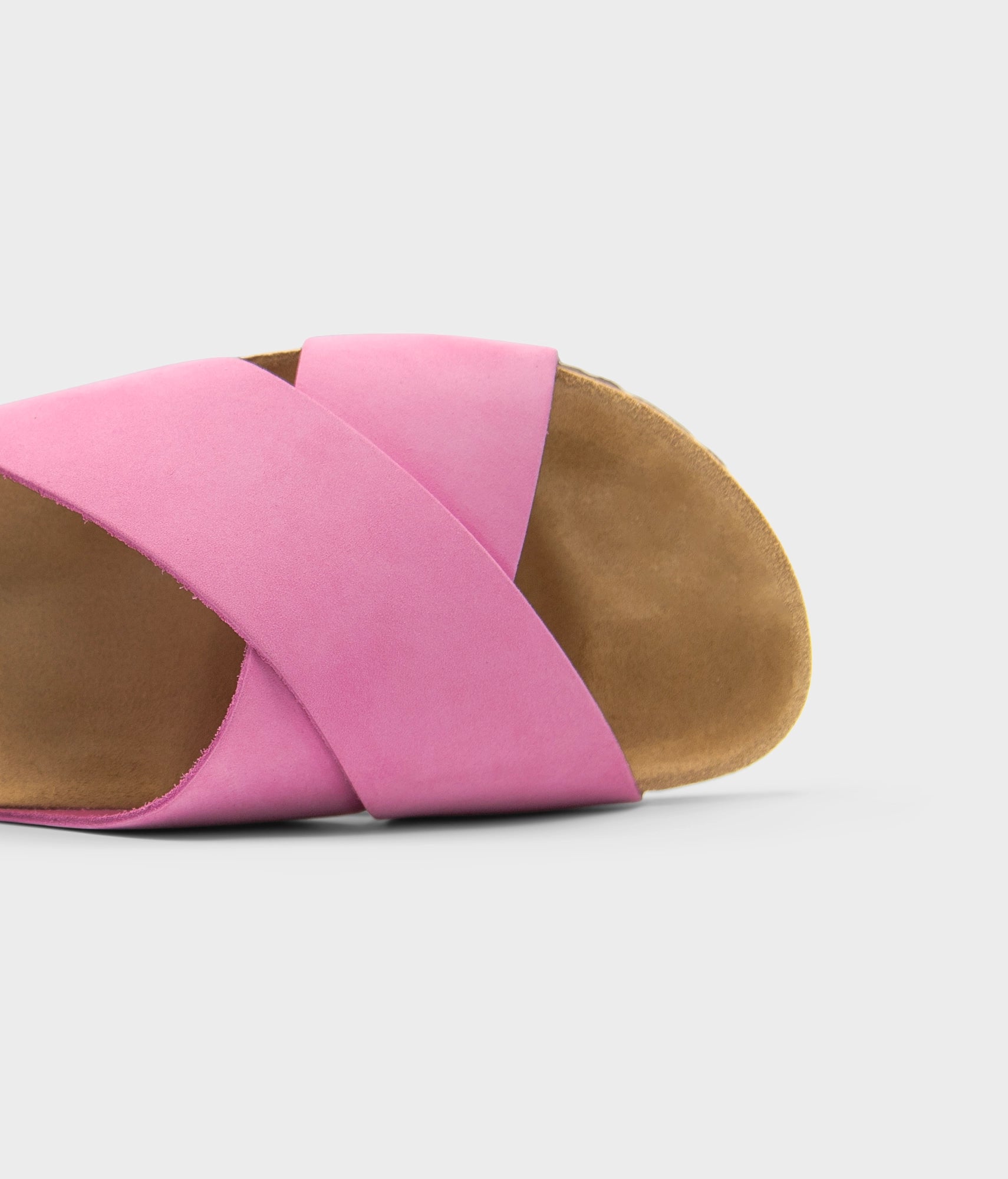 criss cross cork sandal in magenta pink oiled full-grain nubuck leather with a brown EVA outersole and suede footbed