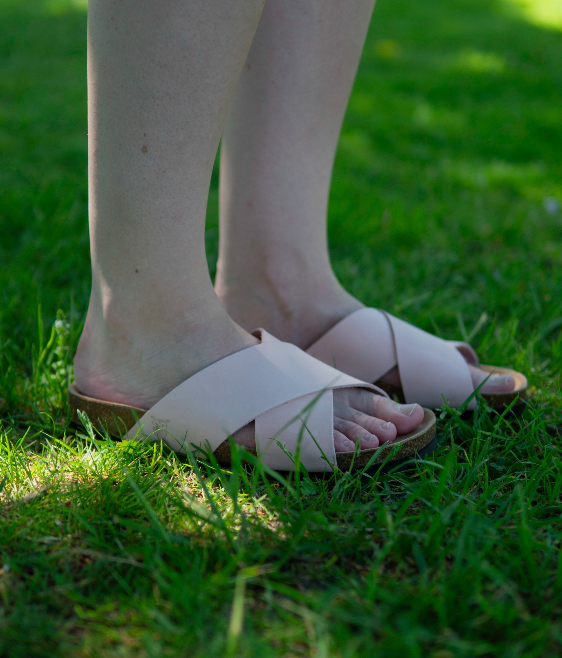 criss cross cork sandal in pale pink oiled full-grain nubuck leather with a brown EVA outersole and suede footbed